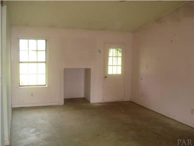 6496 Bellview Pines Road Pensacola, FL 32526 - Photo 8 of 18 Livingroom leading onto back patio and lawn