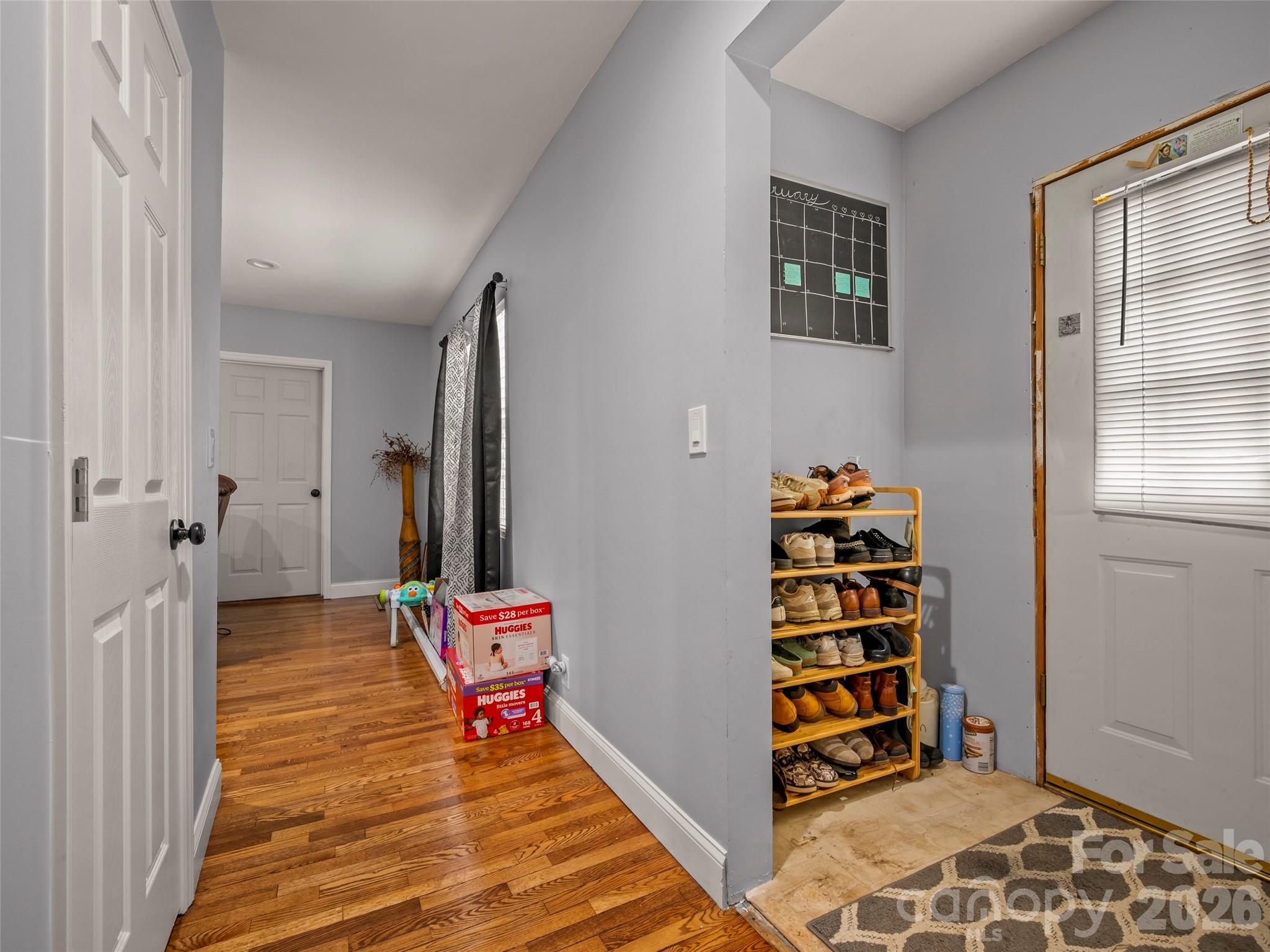 120 East Howard Street Tryon, NC 28782 - Photo 6 of 31 a view of room with stairs and wooden floor