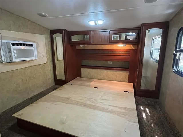 a bathroom with a sink and a refrigerator