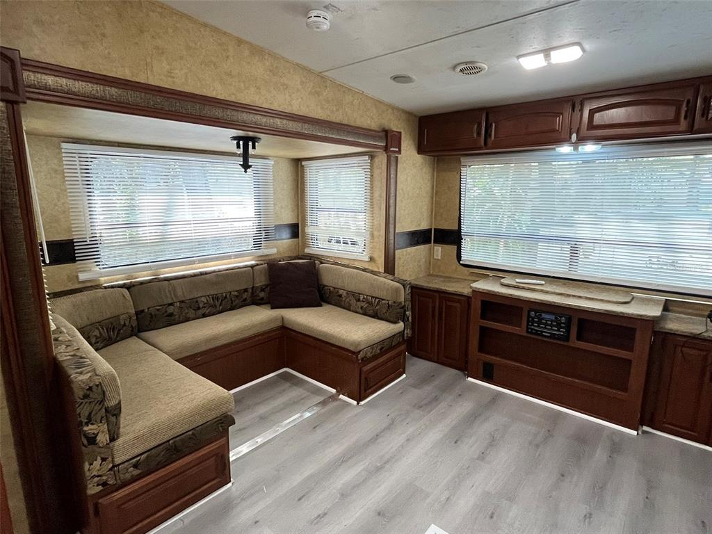 3000 Clarcona Road, Unit 554 Apopka, FL 32703 - Photo 7 of 8 a living room with furniture and a fireplace