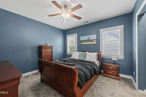 a bed room with a bed and a chandelier