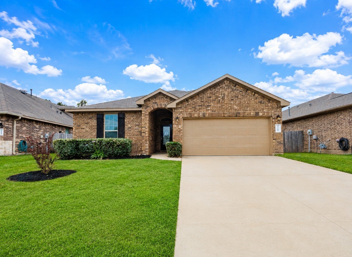 24315 Ravenna Landing Loop Spring, TX 77389 - Photo 4 of 37 a front view of a house with garden