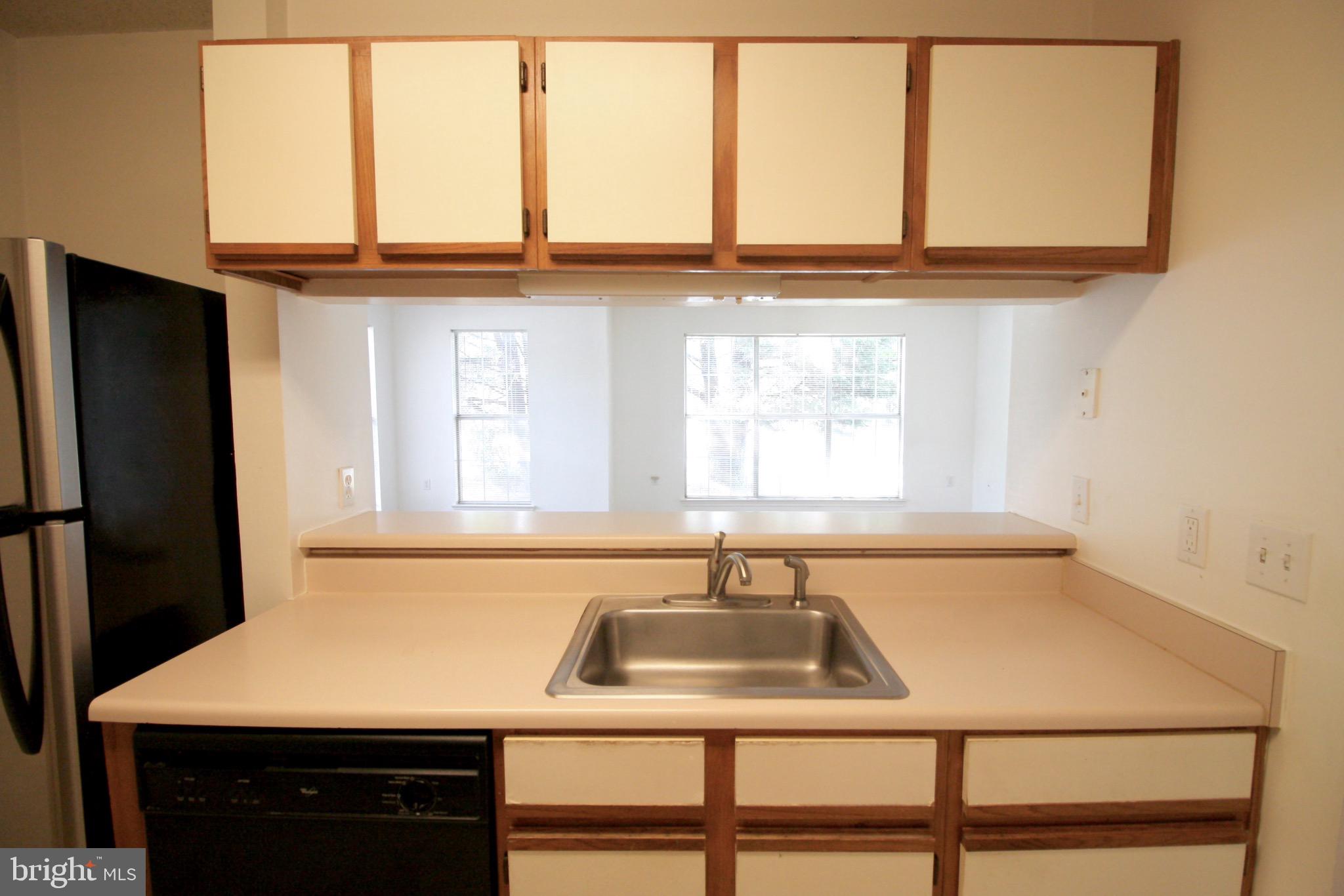 21009 Timber Ridge Terrace, Unit 101 Ashburn, VA 20147 - Photo 11 of 27 Kitchen opens to family/living area