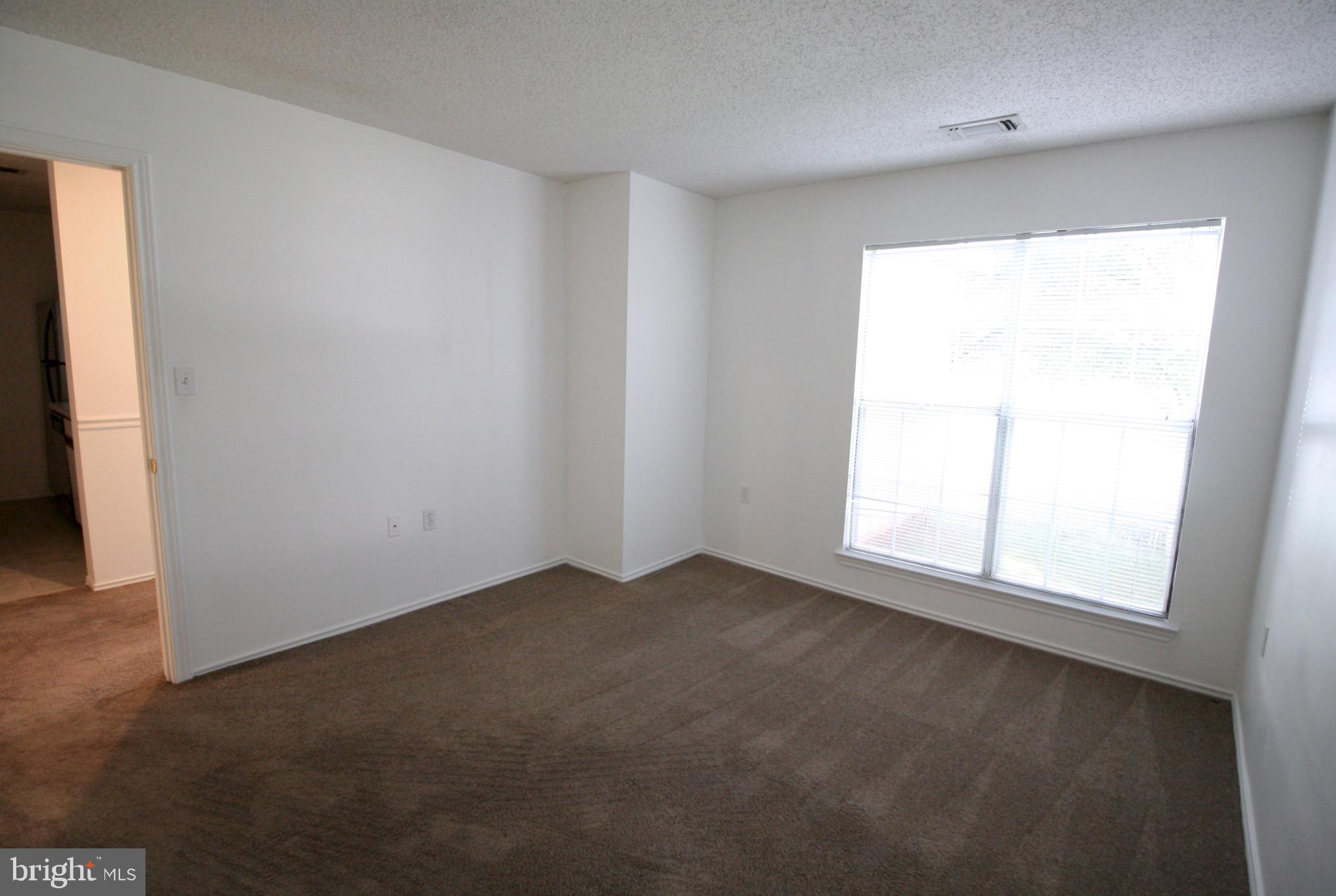 21009 Timber Ridge Terrace, Unit 101 Ashburn, VA 20147 - Photo 13 of 27 Bedroom #1 with large window