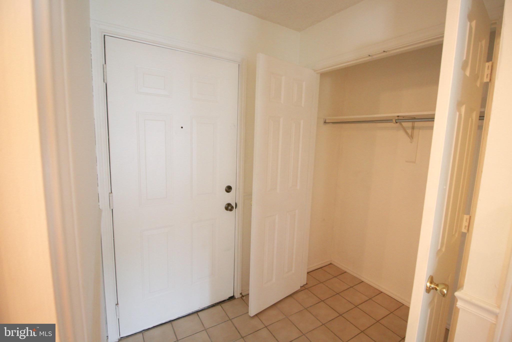 21009 Timber Ridge Terrace, Unit 101 Ashburn, VA 20147 - Photo 7 of 27 Entryway with closet