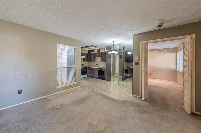 a view of a room with furniture and a fireplace