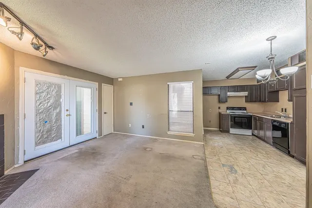 a view of a kitchen with furniture and a kitchen