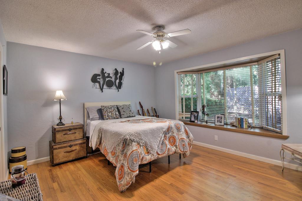 180 Locust Lane Ben Lomond, CA 95005 - Photo 15 of 33 a bedroom with a bed and a large window
