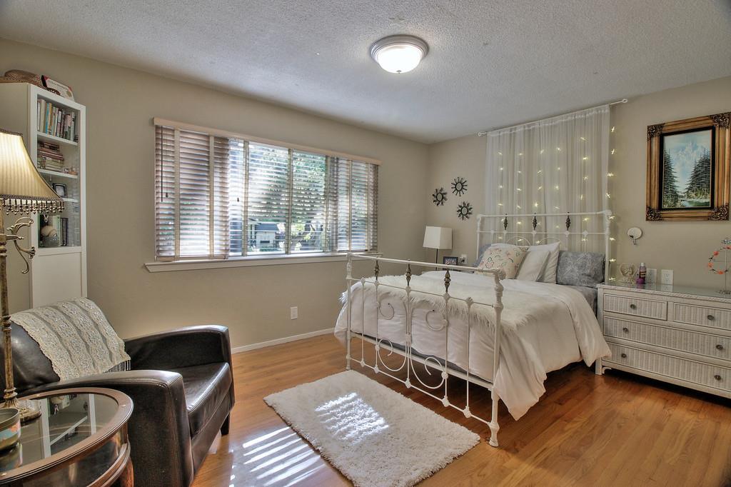180 Locust Lane Ben Lomond, CA 95005 - Photo 16 of 33 a living room with a bed furniture and a window