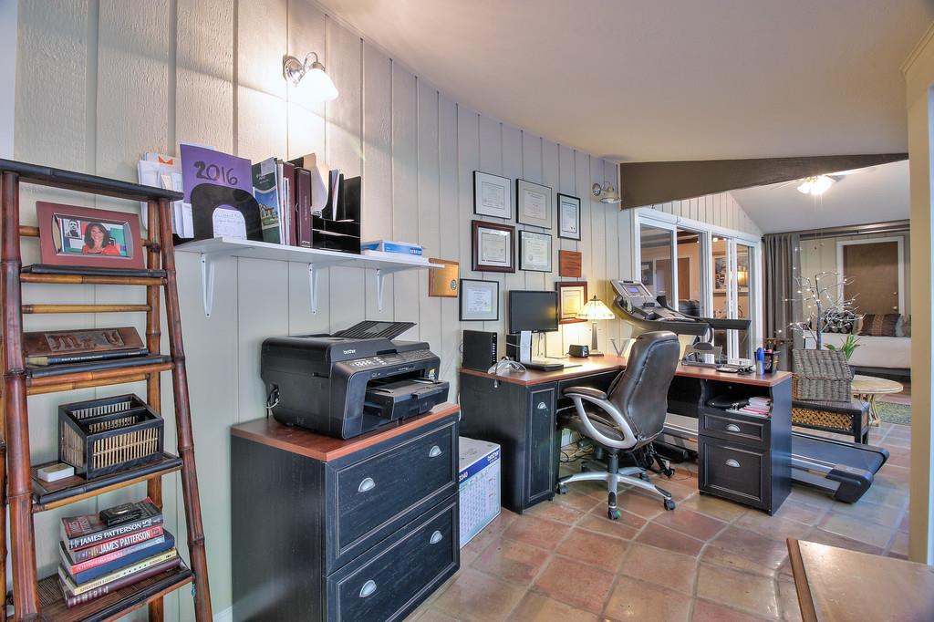 180 Locust Lane Ben Lomond, CA 95005 - Photo 17 of 33 a view of a workspace with furniture and a bookshelf