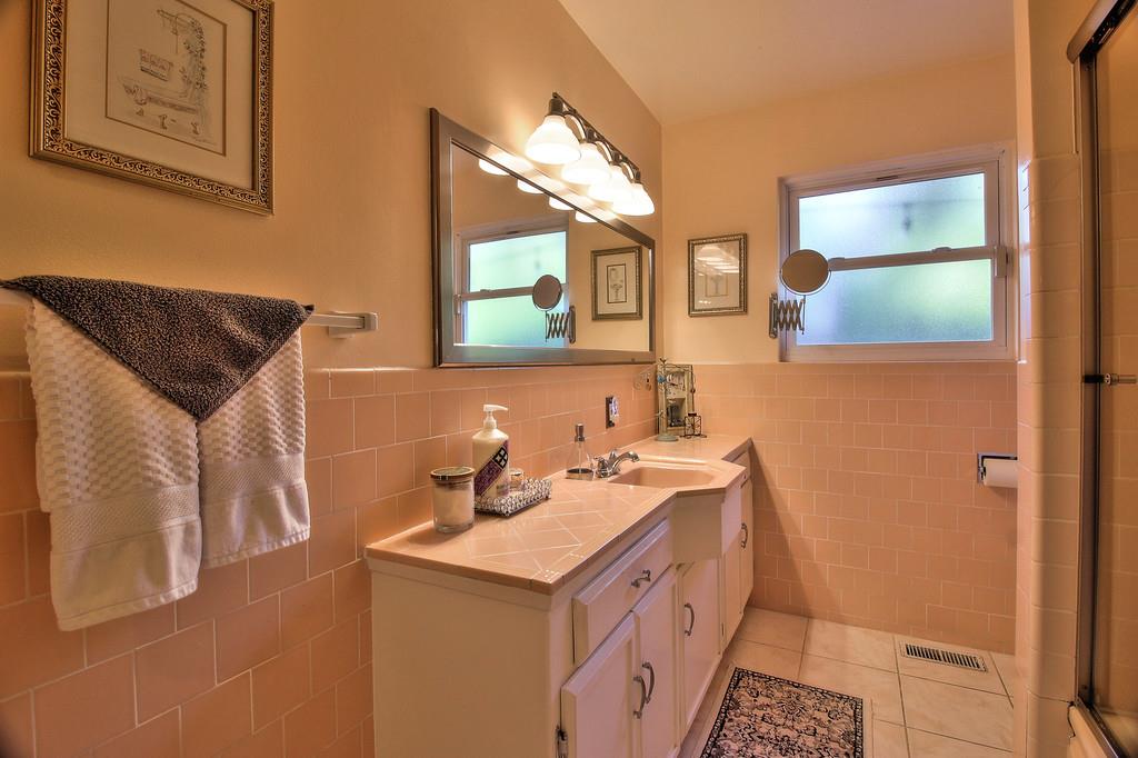 180 Locust Lane Ben Lomond, CA 95005 - Photo 20 of 33 a bathroom with a sink and a mirror