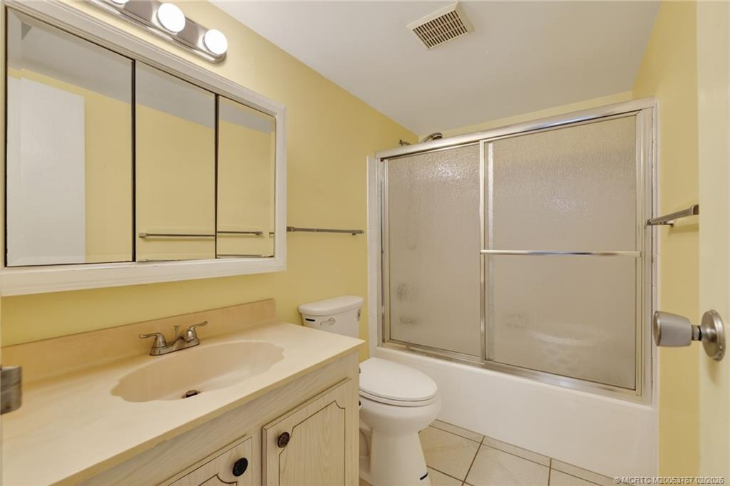 2950 Southeast Ocean Boulevard, Unit 1357 Stuart, FL 34996 - Photo 15 of 25 a bathroom with a sink a toilet and shower