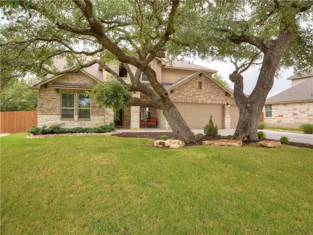 300 Grosseto Lane Georgetown, TX 78628 - Photo 1 of 1 a view of a house with a backyard
