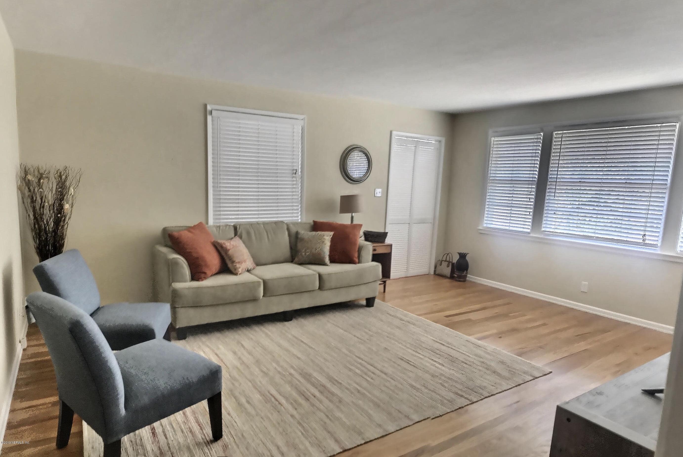 4631 Martingale Road Jacksonville, FL 32210 - Photo 15 of 27 a living room with furniture and a window