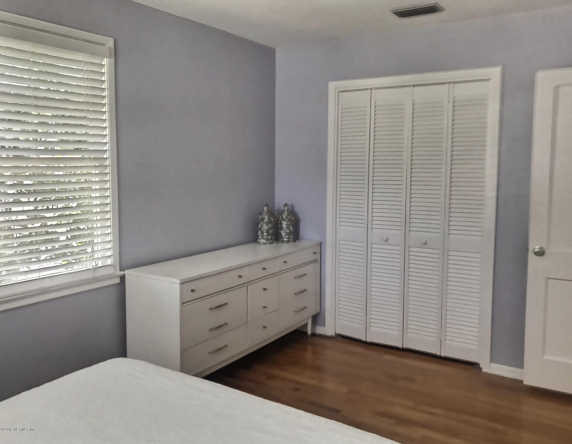 4631 Martingale Road Jacksonville, FL 32210 - Photo 17 of 27 a room with a dresser and a window