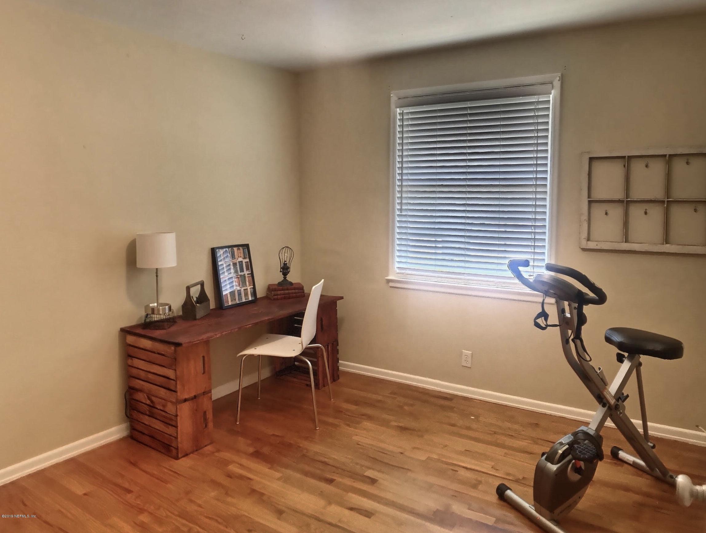 4631 Martingale Road Jacksonville, FL 32210 - Photo 20 of 27 a view of a workspace with furniture and a window