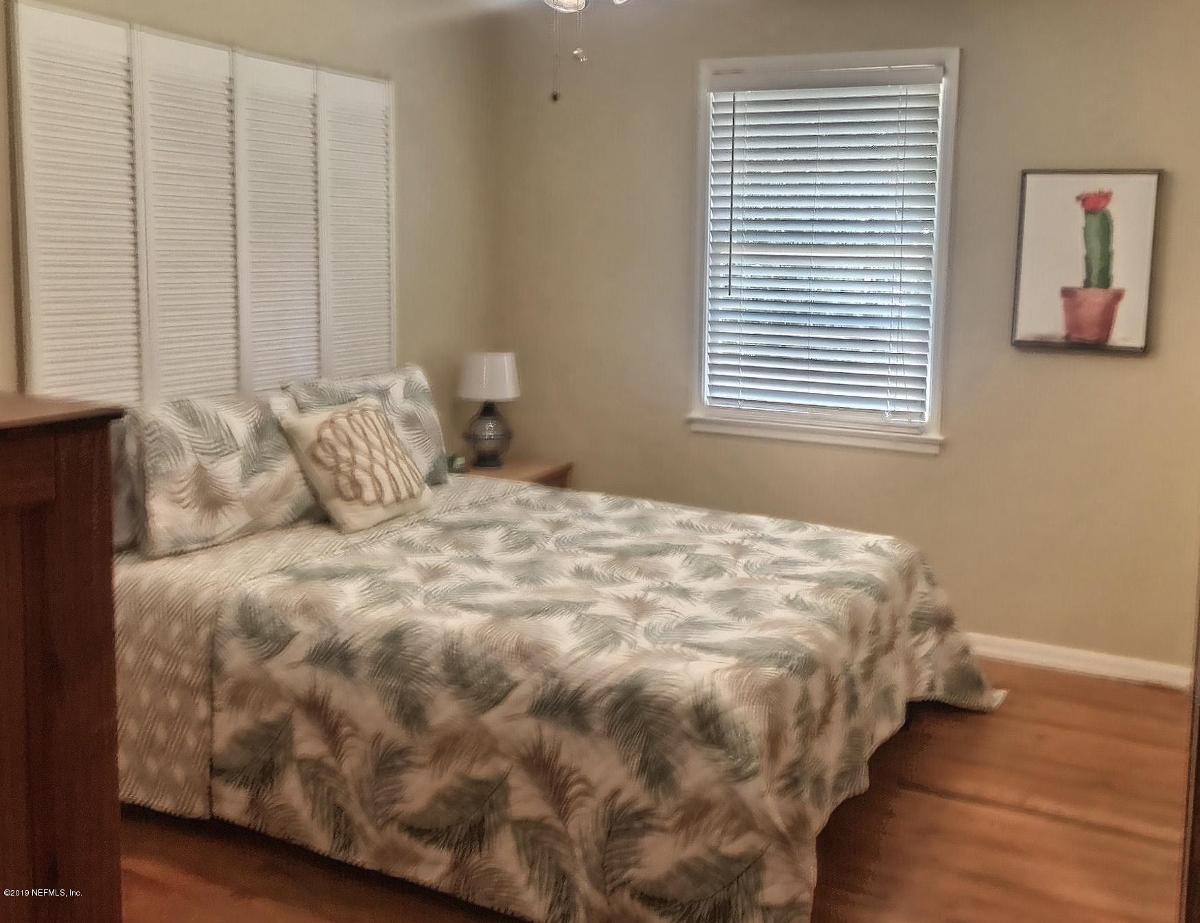 4631 Martingale Road Jacksonville, FL 32210 - Photo 24 of 27 a bedroom with a bed and a window