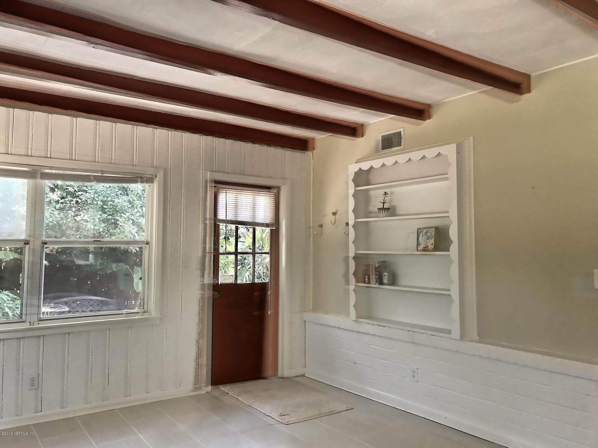 4631 Martingale Road Jacksonville, FL 32210 - Photo 6 of 27 a view of an empty room with a window