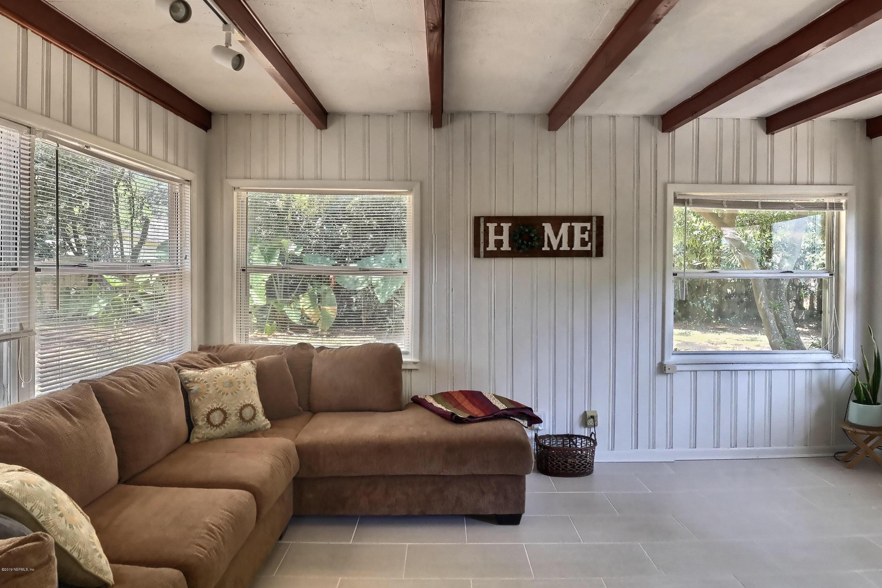 4631 Martingale Road Jacksonville, FL 32210 - Photo 9 of 27 a living room with furniture and a window