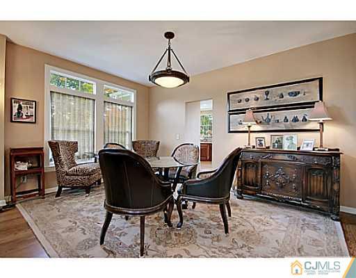 191 Smoke Rise Road Bernards, NJ 07920 - Photo 11 of 25 a view of a dining room with furniture window and outside view