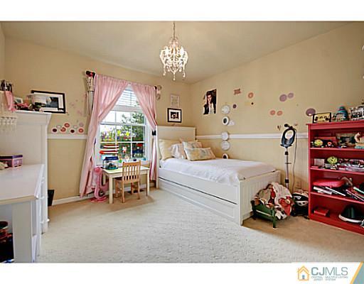 191 Smoke Rise Road Bernards, NJ 07920 - Photo 15 of 25 a bedroom with furniture and a large window
