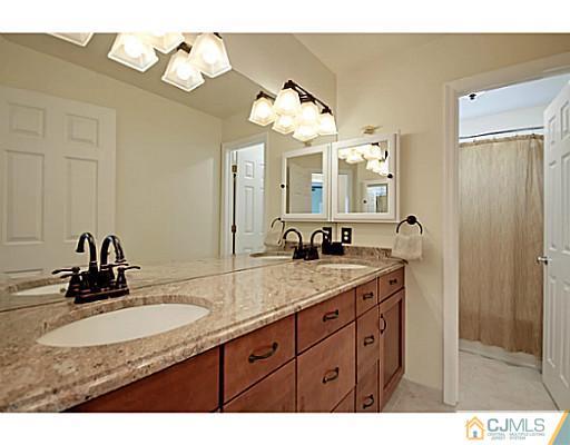 191 Smoke Rise Road Bernards, NJ 07920 - Photo 18 of 25 a bathroom with a sink and a mirror