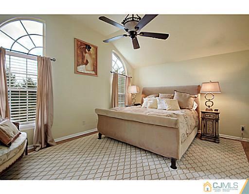 191 Smoke Rise Road Bernards, NJ 07920 - Photo 20 of 25 a living room with a bed furniture and a window