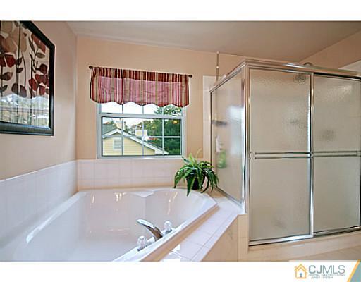 191 Smoke Rise Road Bernards, NJ 07920 - Photo 21 of 25 a bathroom with a tub and a shower