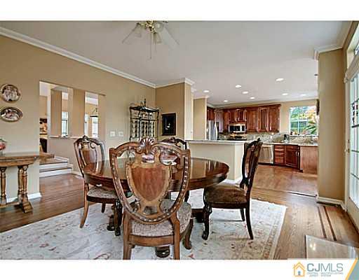 191 Smoke Rise Road Bernards, NJ 07920 - Photo 8 of 25 a dining room with furniture and wooden floor
