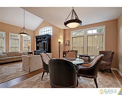 191 Smoke Rise Road Bernards, NJ 07920 - Photo 9 of 25 a dining room with furniture and wooden floor