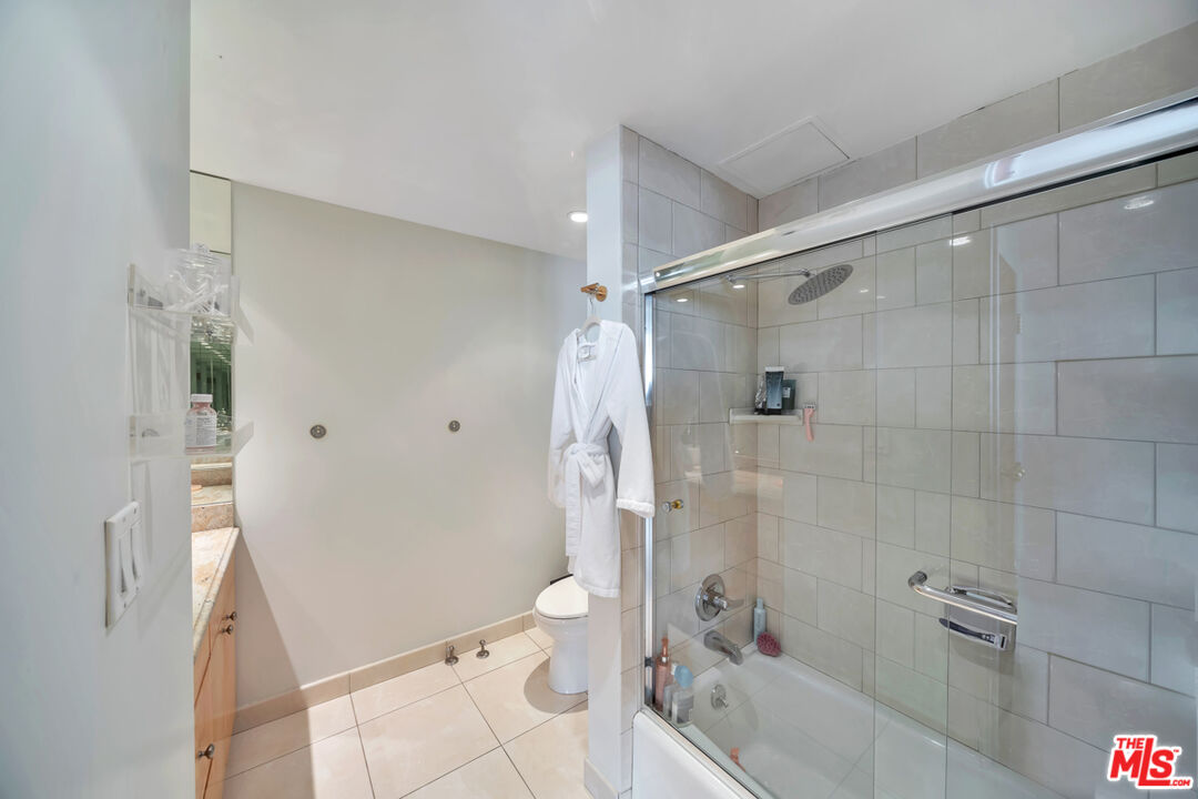 2170 Century Park East, Unit 1807 Los Angeles, CA 90067 - Photo 13 of 30 a bathroom with a sink a toilet and shower