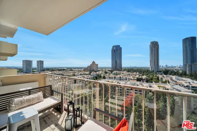 a view of a balcony with chairs