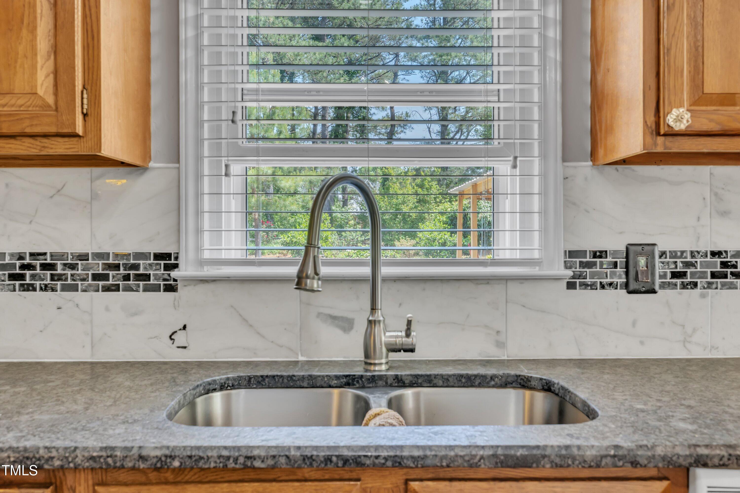 1112 Turner Farms Road Garner, NC 27529 - Photo 19 of 43 a kitchen with a sink and a window