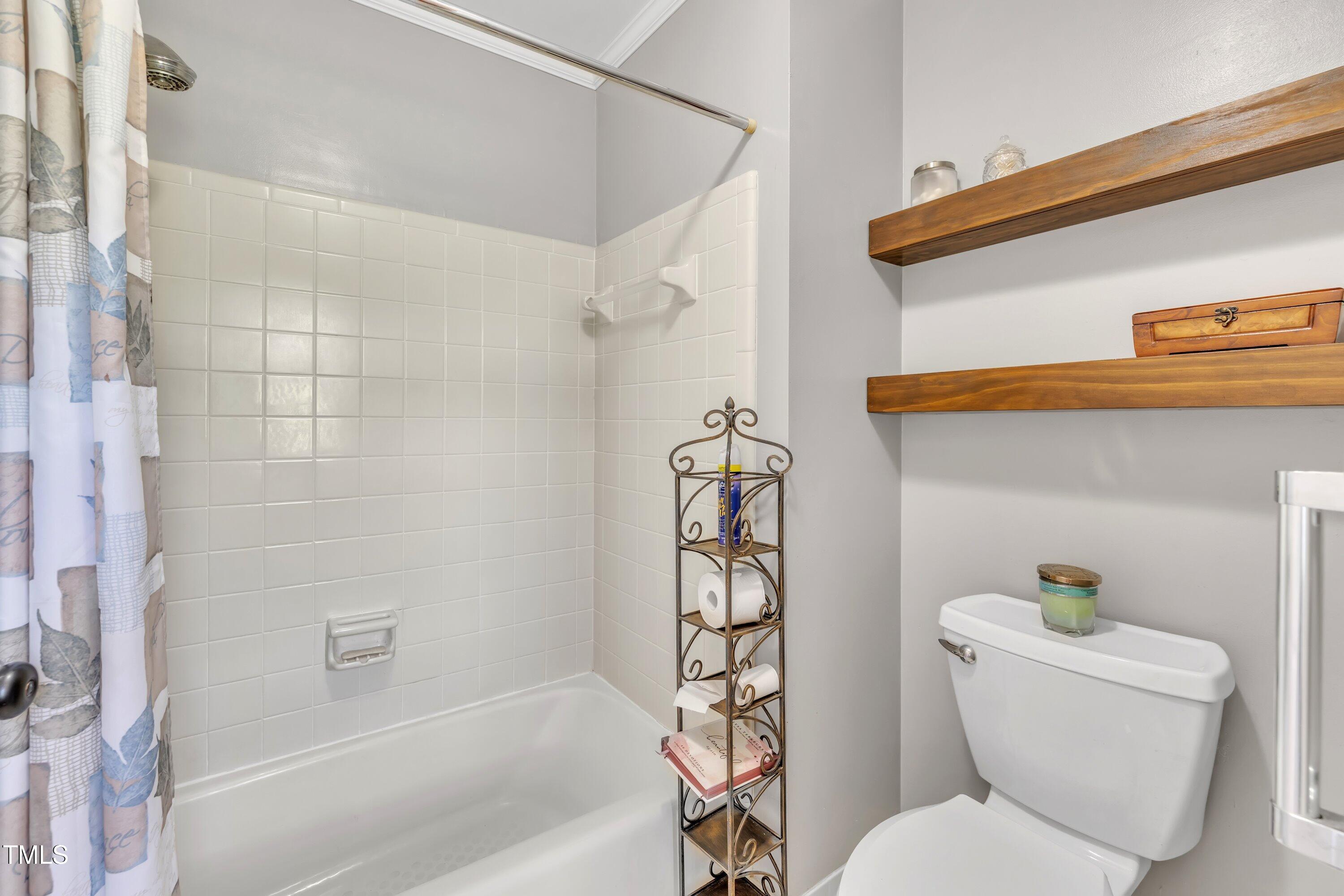1112 Turner Farms Road Garner, NC 27529 - Photo 29 of 43 a bathroom with a toilet and a shower