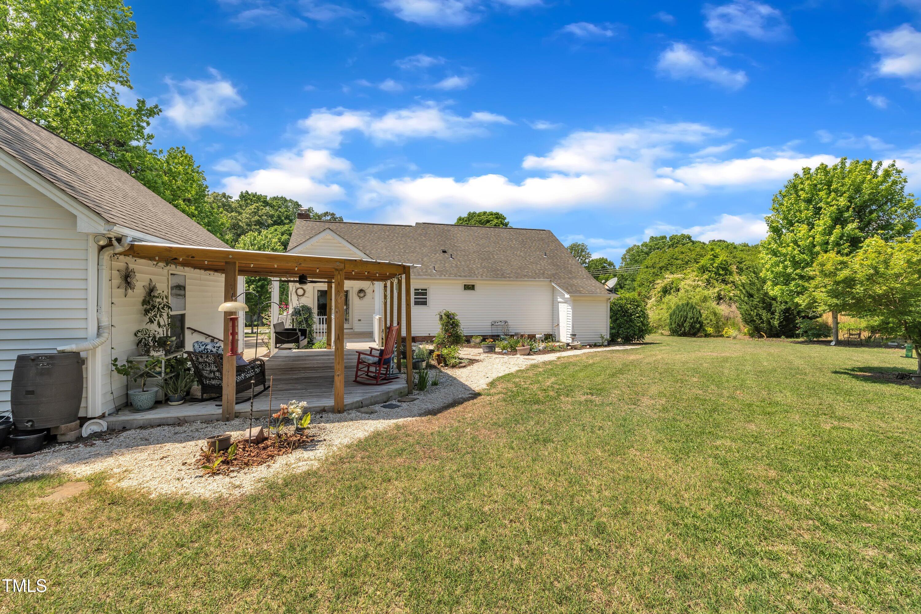1112 Turner Farms Road Garner, NC 27529 - Photo 42 of 43 a view of a house with swimming pool and sitting area