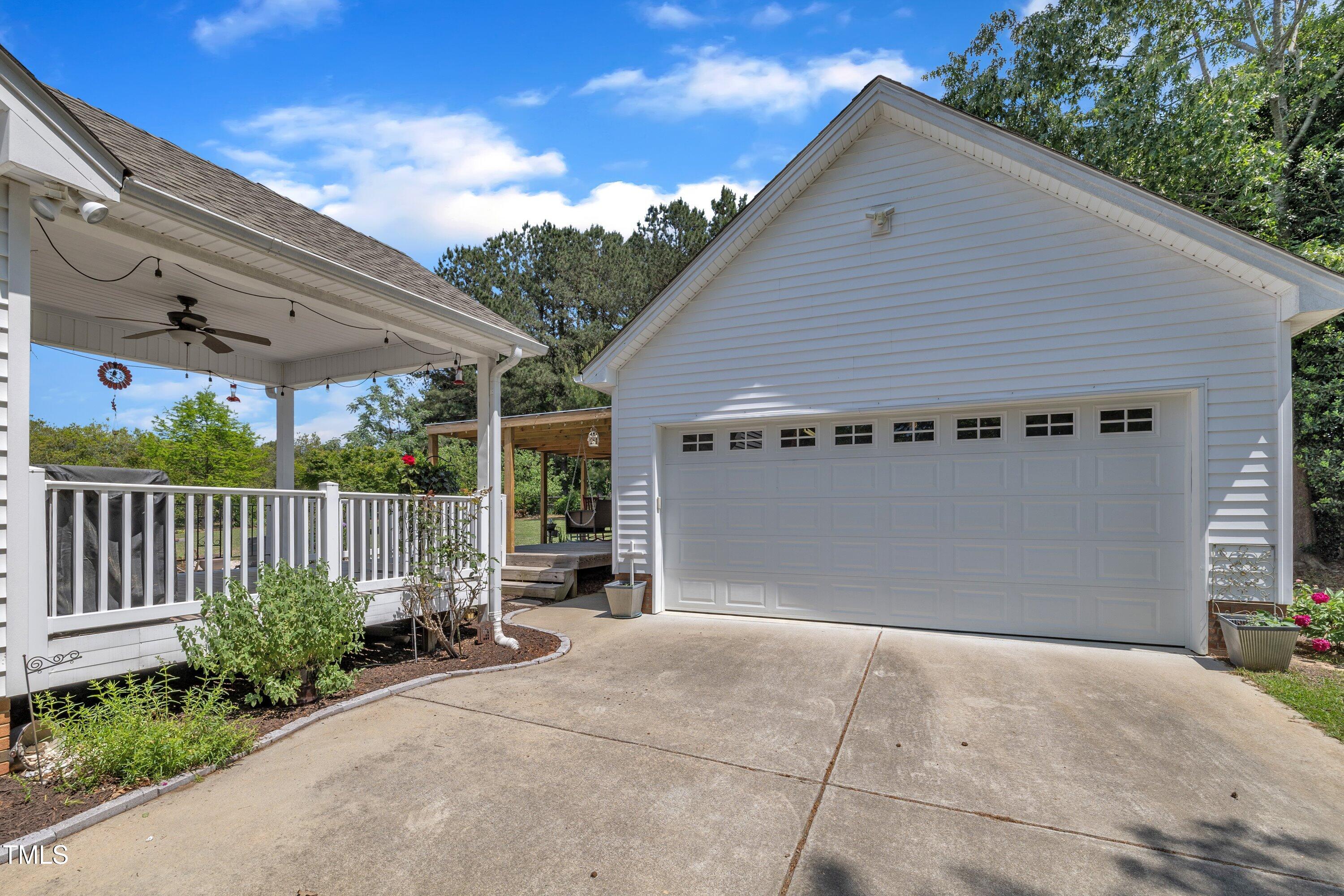 1112 Turner Farms Road Garner, NC 27529 - Photo 5 of 43 a view of a house with porch and garden