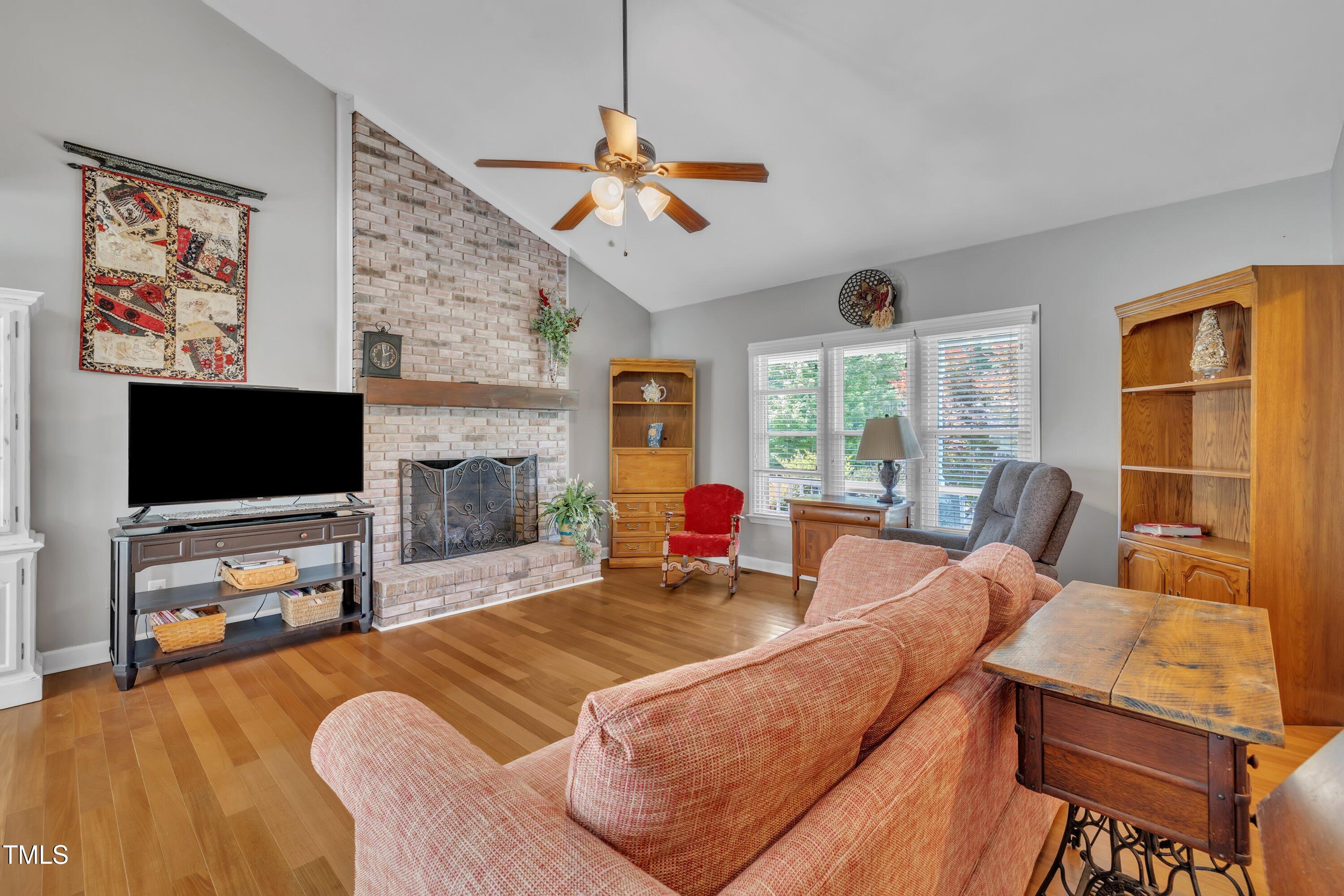 1112 Turner Farms Road Garner, NC 27529 - Photo 9 of 43 a living room with furniture and a flat screen tv
