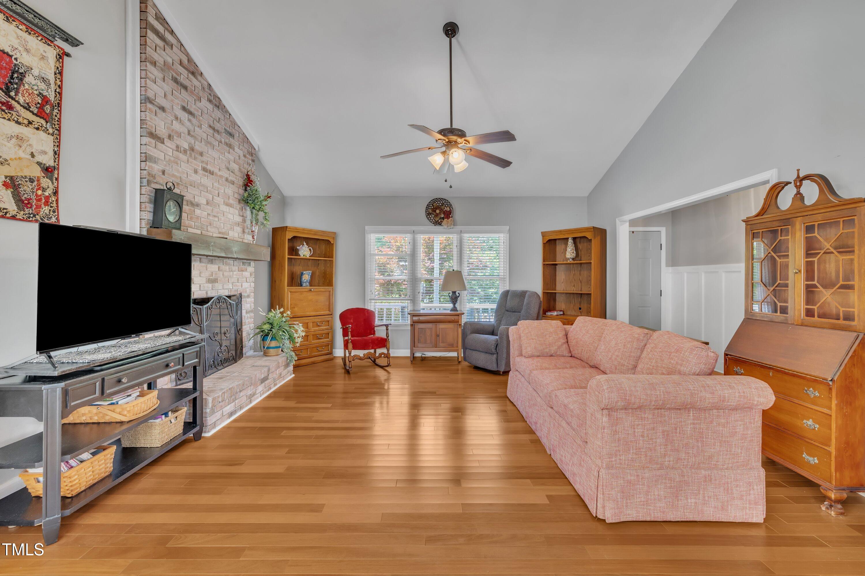 1112 Turner Farms Road Garner, NC 27529 - Photo 10 of 43 a living room with furniture and a flat screen tv