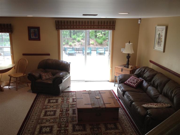 65 River Harbor Road Wellfleet, MA 02667 - Photo 30 of 35 a living room with furniture and a large window