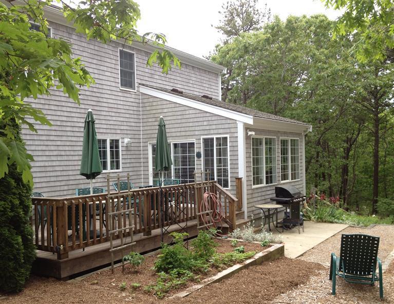 65 River Harbor Road Wellfleet, MA 02667 - Photo 3 of 35 a view of a house with backyard and sitting area