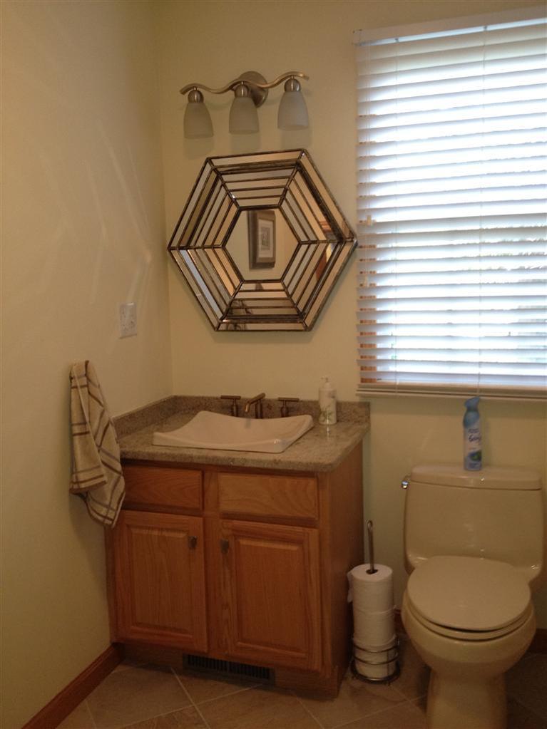 65 River Harbor Road Wellfleet, MA 02667 - Photo 33 of 35 a bathroom with a granite countertop toilet and a sink