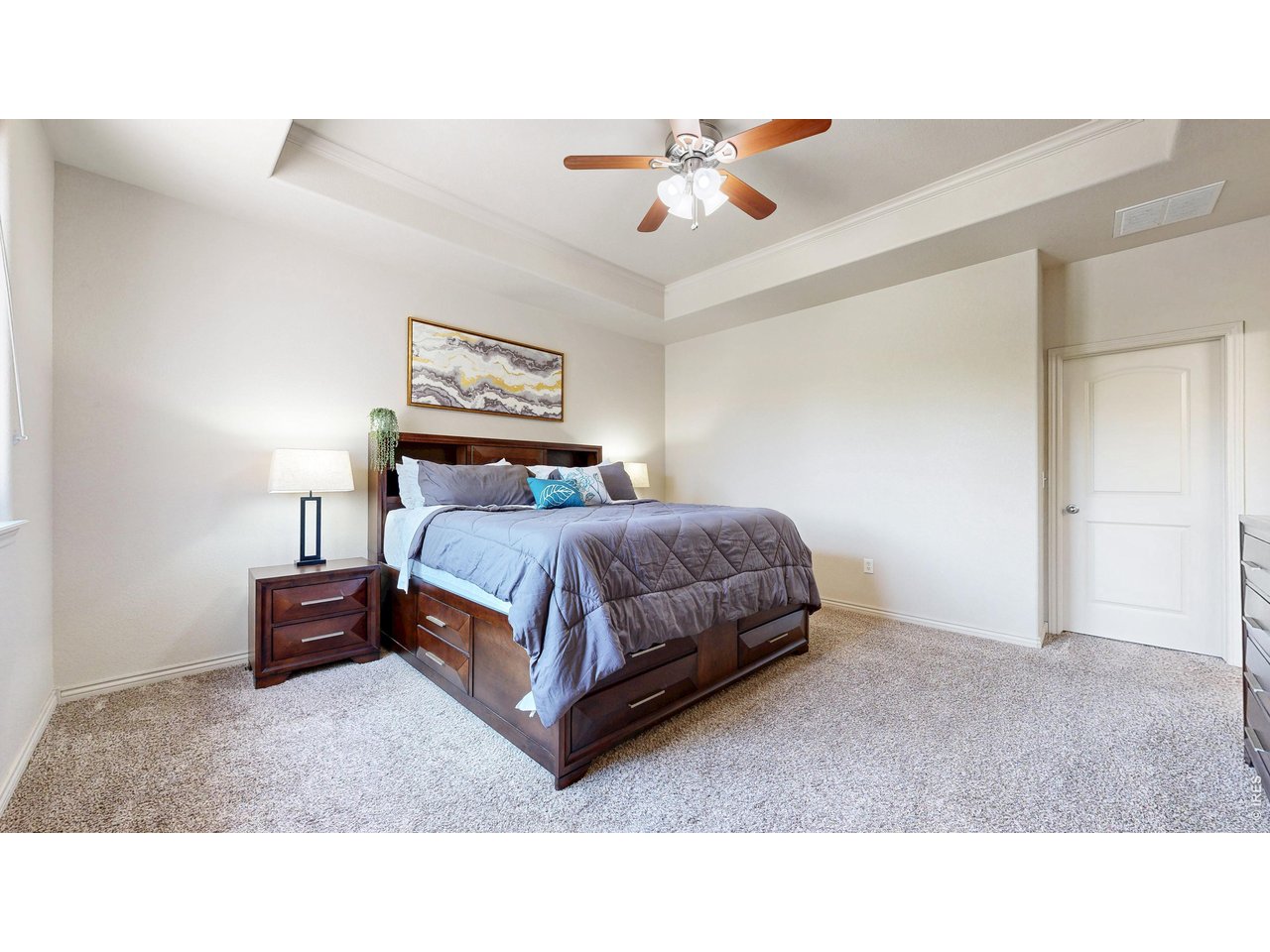 4672 West 20th Road, Unit 413 Greeley, CO 80634 - Photo 18 of 37 a bedroom with a bed and lamp