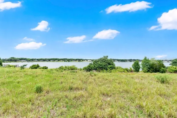 a view of a lake and a yard