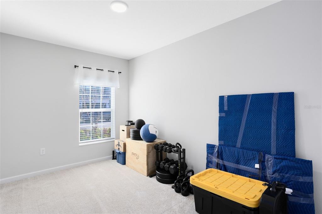 4394 Campsite Loop Orlando, FL 32824 - Photo 14 of 40 a living room with furniture and a window