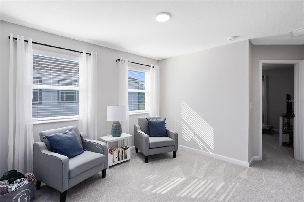 4394 Campsite Loop Orlando, FL 32824 - Photo 17 of 40 a living room with furniture and a window