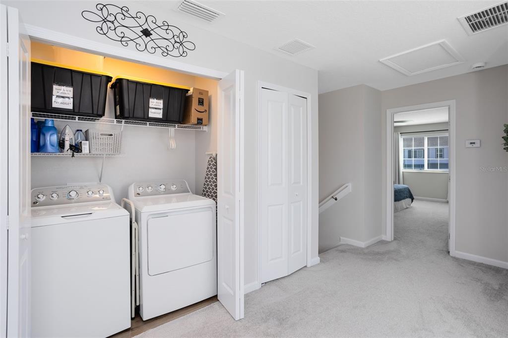 4394 Campsite Loop Orlando, FL 32824 - Photo 18 of 40 a view of storage and utility room with washer and dryer