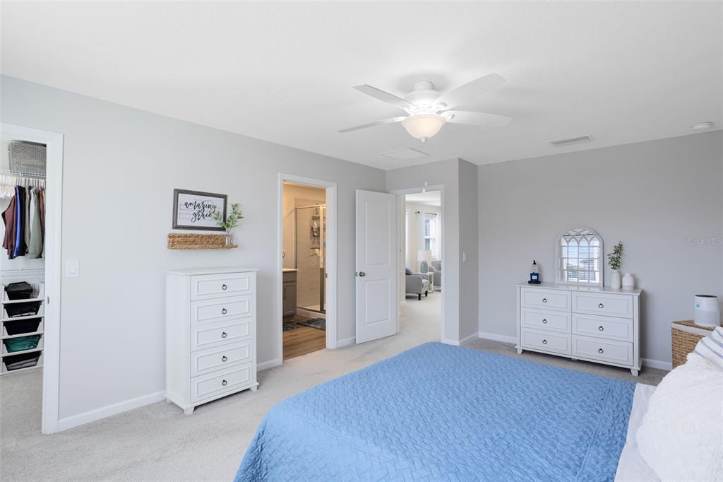 4394 Campsite Loop Orlando, FL 32824 - Photo 20 of 40 a view of a bedroom with bed and cabinet