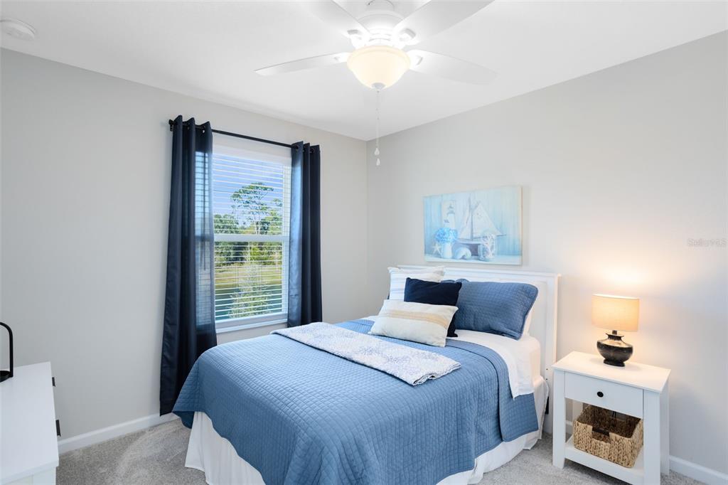 4394 Campsite Loop Orlando, FL 32824 - Photo 24 of 40 a bedroom with a bed and a window