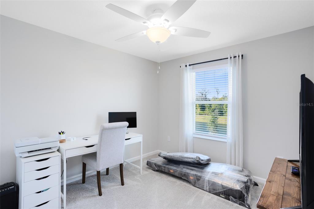 4394 Campsite Loop Orlando, FL 32824 - Photo 27 of 40 a bedroom with a bed and a window