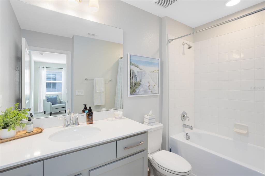 4394 Campsite Loop Orlando, FL 32824 - Photo 28 of 40 a bathroom with a sink toilet and shower